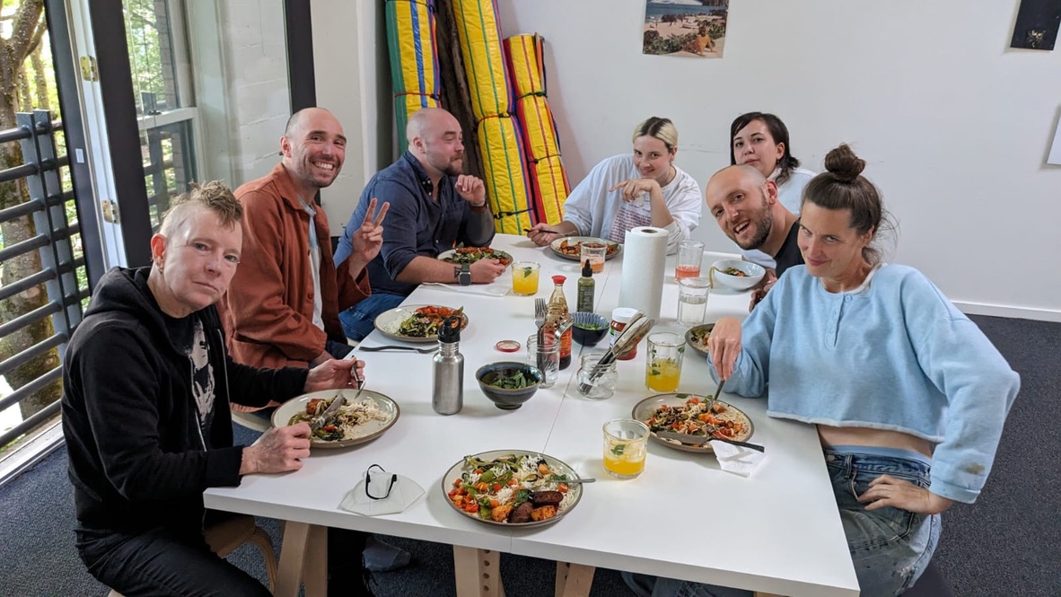 Friends sharing a meal at School of Art and Time